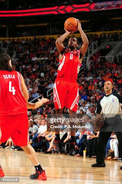 Aaron Brooks of the Houston Rockets shoots a jump shot against the Phoenix Suns during the game at U.S. Airways Center on April, 2010 in Phoenix,...