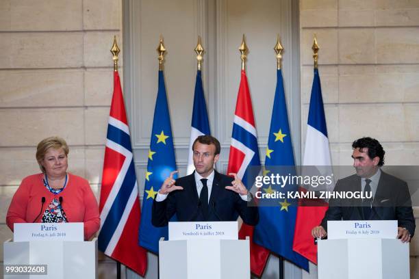 French President Emmanuel Macron, Norway's Prime Minister Erna Solberg and Saudi Arabia's Yasir Al-Rumayyan, the Managing Director of the Public...