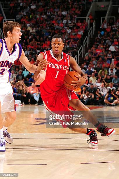 Kyle Lowry of the Houston Rockets drives against Goran Dragic of the Phoenix Suns during the game at U.S. Airways Center on April, 2010 in Phoenix,...