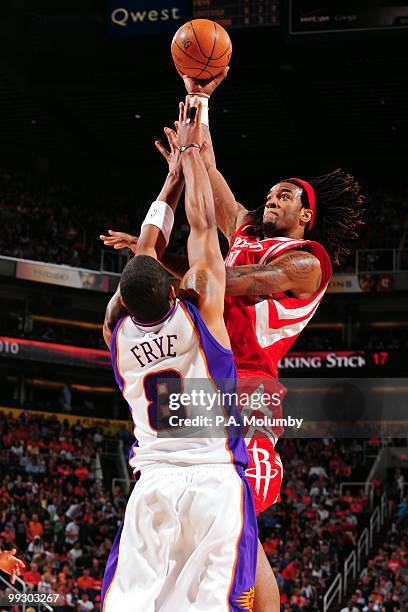 Jordan Hill of the Houston Rockets goes up for a shot against Channing Frye of the Phoenix Suns during the game at U.S. Airways Center on April, 2010...