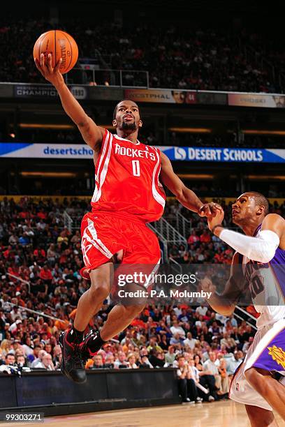 Aaron Brooks of the Houston Rockets goes to the basket against Leandro Barbosa of the Phoenix Suns during the game at U.S. Airways Center on April,...