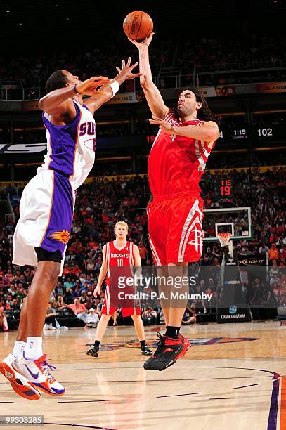 Luis Scola of the Houston Rockets shoots against Channing Frye of the Phoenix Suns during the game at U.S. Airways Center on April, 2010 in Phoenix,...