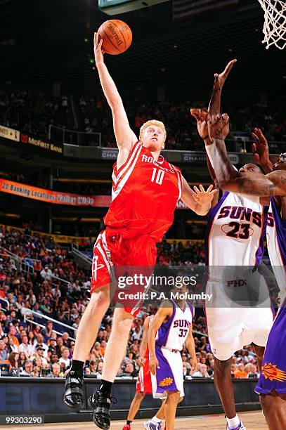 Chase Budinger of the Houston Rockets goes to the basket against Jason Richardson of the Phoenix Suns during the game at U.S. Airways Center on...