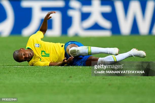 Brazil's midfielder Fernandinho reacts after a challenge during the Russia 2018 World Cup quarter-final football match between Brazil and Belgium at...