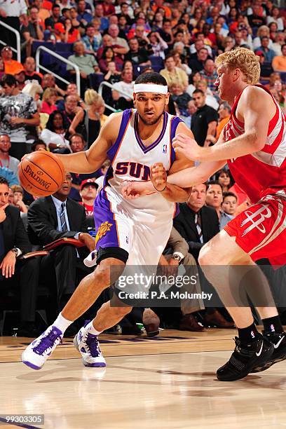 Jared Dudley of the Phoenix Suns drives against Chase Budinger of the Houston Rockets during the game at U.S. Airways Center on April, 2010 in...