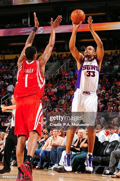 Grant Hill of the Phoenix Suns shoots a jump shot against Trevor Ariza of the Houston Rockets during the game at U.S. Airways Center on April, 2010...