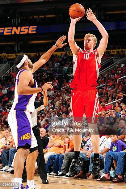 Chase Budinger of the Houston Rockets shoots a jump shot against Jared Dudley of the Phoenix Suns during the game at U.S. Airways Center on April,...