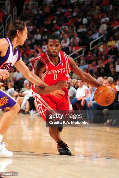 Aaron Brooks of the Houston Rockets dribbles against Steve Nash of the Phoenix Suns during the game at U.S. Airways Center on April, 2010 in Phoenix,...