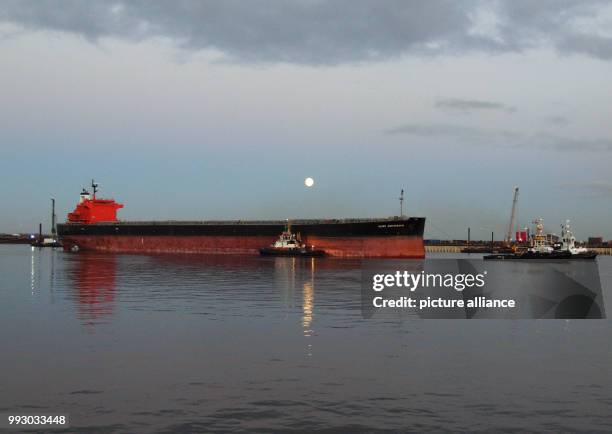 Number of tug-boats lead damaged freighter 'Glory Amsterdam' into the port of Wilhelmshaven, Germany, 02 November 2017. The freighter hit a sandbank...
