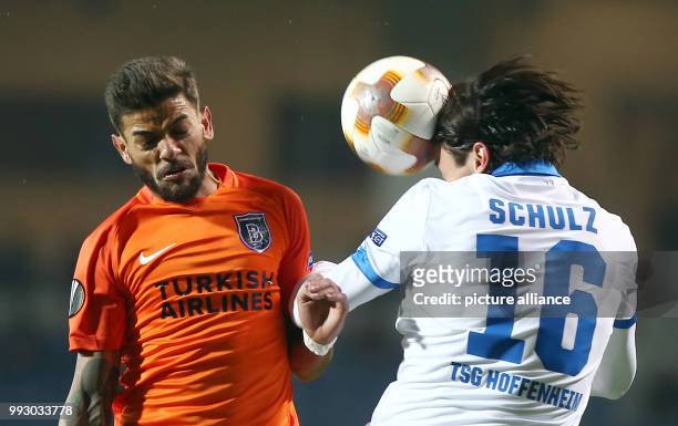 Hoffenheim's Nico Schulz and Istanbul's Junior Caicara in action during the Europa League group C soccer match between Istanbul Basaksehir and 1899...