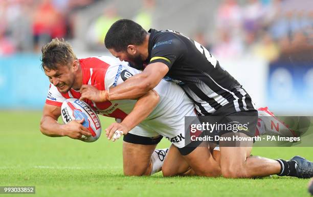 St Helens' Jon Wilkin is tackled by Widnes Vikings' Macgraff Leuluai during the Betfred Super League match at The Totally Wicked Stadium, St Helens.