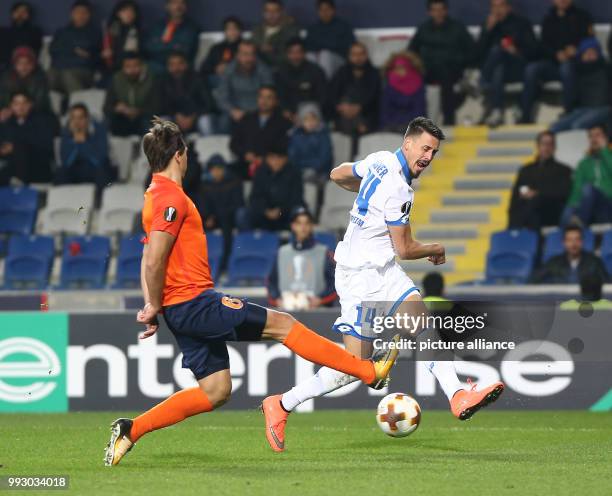 Hoffenheim's Sandro Wagner and Istanbul Basaksehir's Alexandru Epureanu vie for the ball during the UEFA Europa League Group C football match at the...