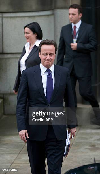 Britain's Prime Minister David Cameron leaves after a meeting with Leader of the Scottish National Party , Alex Salmond at St Andrews House, in...