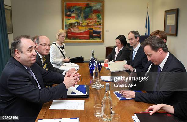 New British Prime Minister Prime Minister David Cameron talks to Scottish First Minister Alex Salmond during a visit to St Andrews House, in...