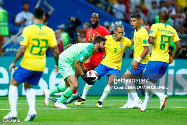 Brazil's goalkeeper Alisson makes a save during the Russia 2018 World Cup quarter-final football match between Brazil and Belgium at the Kazan Arena...