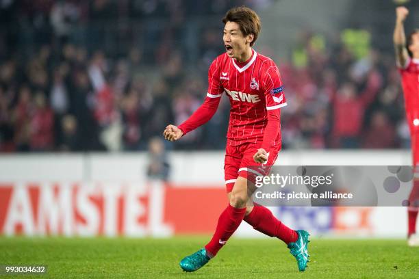 Cologne's Yuya Osako cheers over his 2-2 score during the Europa League group H soccer match between 1. FC Cologne and BATE Borisov in Cologne,...