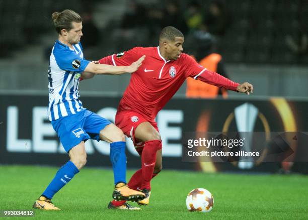 Berlin's Karim Rekik and Zorya's Lury vie for the ball during the Europa League group J soccer match between Hertha BSC and Zorya Luhansk at the...