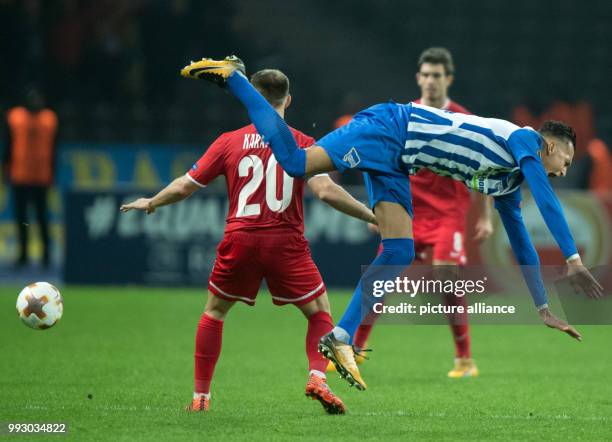 Berlin's Davie Selke and Zorya's Oleksandr Karavaev vie for the ball during the Europa League group J soccer match between Hertha BSC and Zorya...