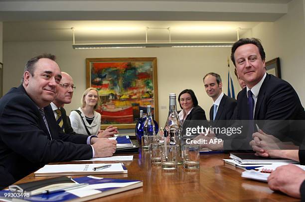 New British Prime Minister Prime Minister David Cameron and Scottish First Minister Alex Salmond pose for a photo during a meeting at St Andrews...