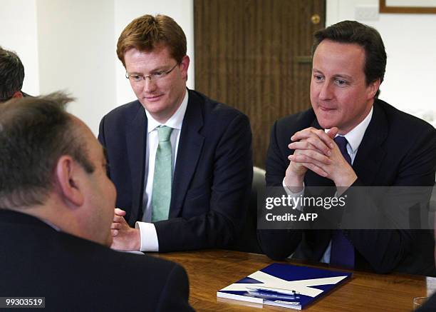 New British Prime Minister Prime Minister David Cameron talks to Scottish First Minister Alex Salmond during a visit to St Andrews House, in...