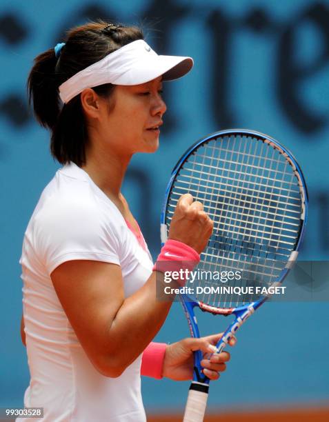 China's Na Li reacts to play against Israeli Shahar Peer during their Madrid Masters tennis match on May 14, 2010 at the Caja Magic sports complex in...