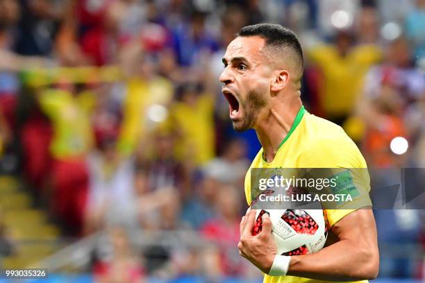 Brazil's midfielder Renato Augusto reacts after scoring his team's first goal during the Russia 2018 World Cup quarter-final football match between...