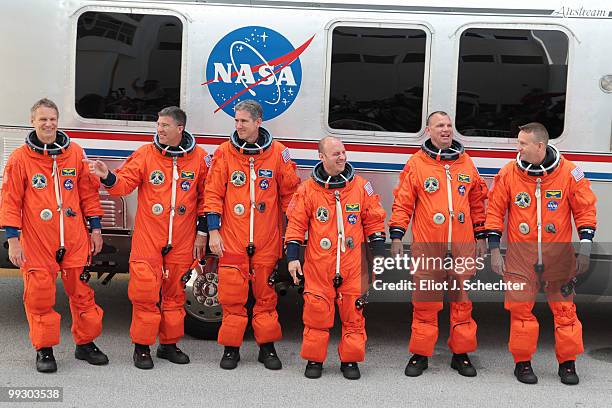 Space Shuttle Atlantis Commander Ken Ham, Pilot Tony Antonelli, Mission Specialists Garrett Reisman, Michael Good, Steve Bowen and Piers Sellers walk...