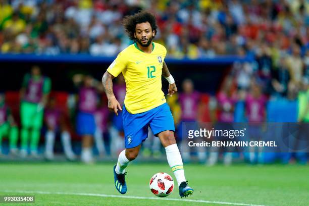 Brazil's defender Marcelo runs with the ball during the Russia 2018 World Cup quarter-final football match between Brazil and Belgium at the Kazan...