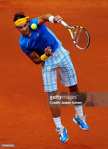 Rafael Nadal of Spain serves the ball to Gael Monfils of France in their quarter final match during the Mutua Madrilena Madrid Open tennis tournament...
