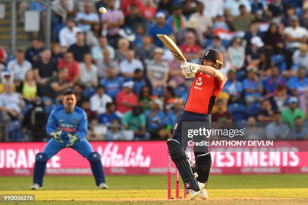 England's Eoin Morgan is caught out on the boundary by India's Shikhar Dhawan playing this shot during the international Twenty20 cricket match...