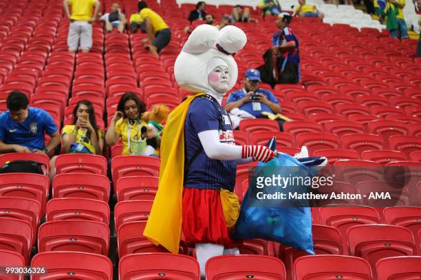 Fan of Japan cleans up rubbish at the end of the 2018 FIFA World Cup Russia Quarter Final match between Brazil and Belgium at Kazan Arena on July 6,...