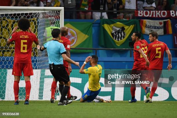 Brazil's midfielder Renato Augusto reacts after missing shot during the Russia 2018 World Cup quarter-final football match between Brazil and Belgium...