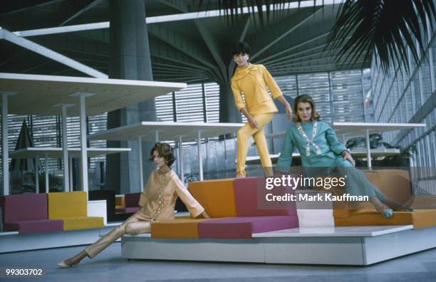 View of a group of unidentified fashion models dressed in Irene Galitzine clothing as they pose in the lobby of the Palazzo del Lavoro, Turin, Italy,...