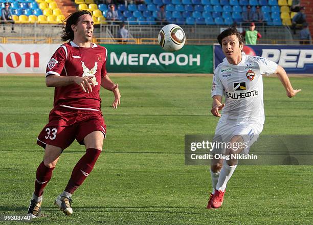 Jordi of FC Rubin Kazan battles for the ball with Alan Dzagoev of PFC CSKA Moscow during the Russian Football League Championship match between FC...