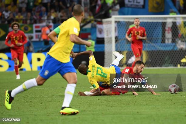 Brazil's midfielder Fernandinho commits a foul on Belgium's forward Eden Hazard during the Russia 2018 World Cup quarter-final football match between...