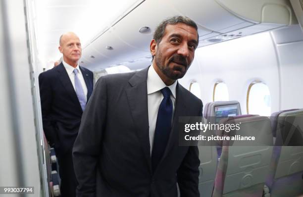 Head of Airbus Thomas Enders and the chairman of the Emirates Group, sheik Ahmed bin Saeed Al Maktoum inspect a first class cabin inside an Airbus...