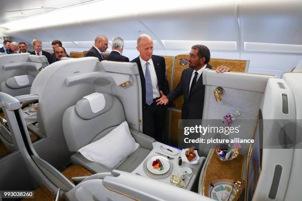 Head of Airbus Thomas Enders and the chairman of the Emirates Group, Sheik Ahmed bin Saeed Al Maktoum inspect a first class cabin inside an Airbus...