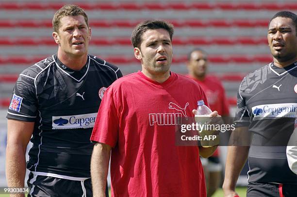 Biarritz's players Jerome Thion , Dimitri Yachvili and Mosese Moala take part in a training session on May 14, 2010 at the Aguilera stadium in...