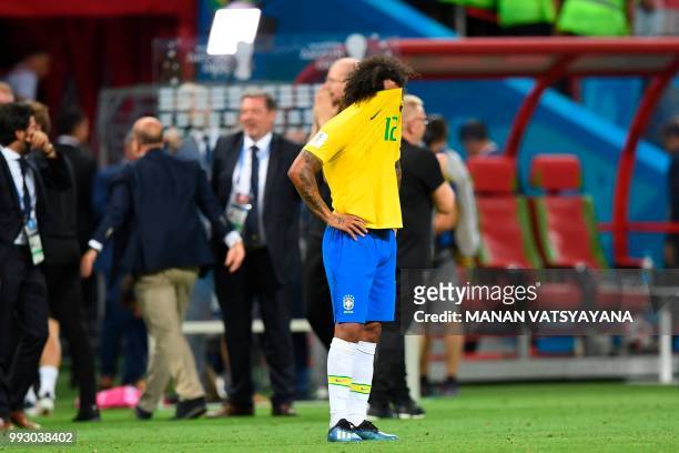 Brazil's defender Marcelo reacts to their defeat at the end of the Russia 2018 World Cup quarter-final football match between Brazil and Belgium at...