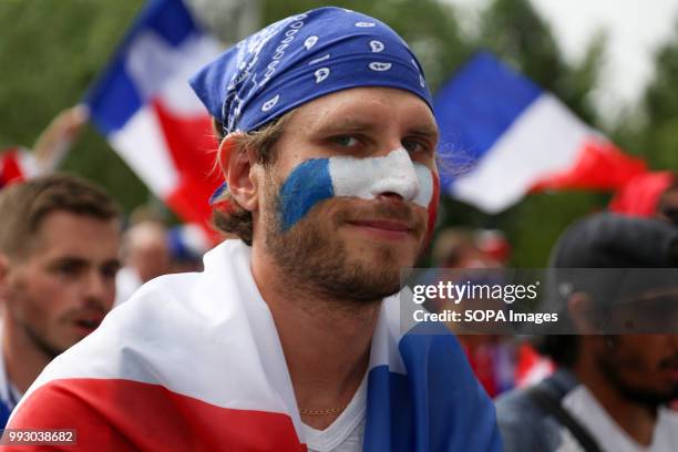 French football fan seen during the match. French football fans celebrate their national football team victory over uruguay during the quarterfinal...