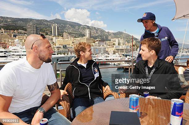 Skier Marco Buchel, Sebastian Vettel of Germany and Red Bull Racing, ski-jumper Simon Ammann and ski-jumper Gregor Schlierenzauer are seen on the Red...
