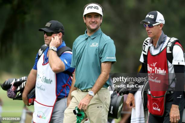 Bubba Watson smiles while walking off the ninth tee during round two of A Military Tribute At The Greenbrier held at the Old White TPC course on July...