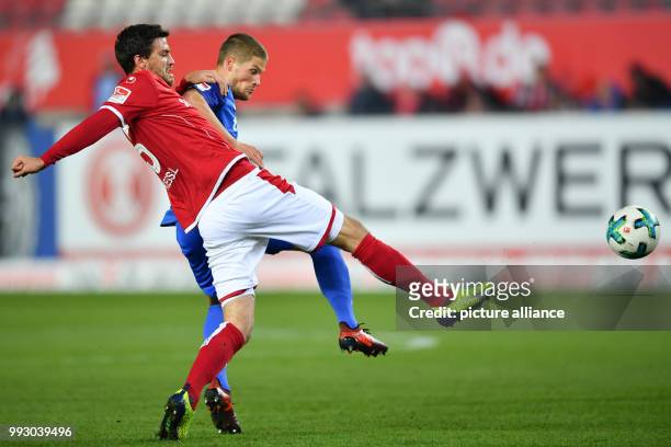 Kaiserslautern's Benjamin Kessel and Bochum's Johannes Wurtz vie for the ball during the German 2nd division Bundesliga soccer match between 1. FC...