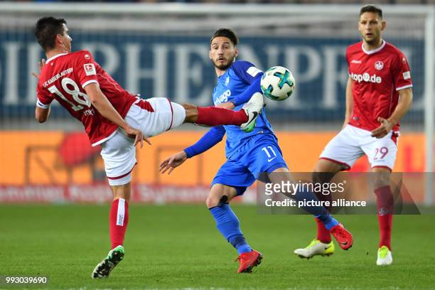 Kaiserslautern's Christoph Moritz and Kaiserslautern's Stipe Vucur in action against Bochum's Dimitrios Diamantakos during the German 2nd division...