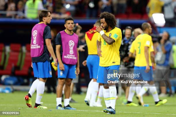 Marcelo of Brazil is consoled at the end of during the 2018 FIFA World Cup Russia Quarter Final match between Brazil and Belgium at Kazan Arena on...