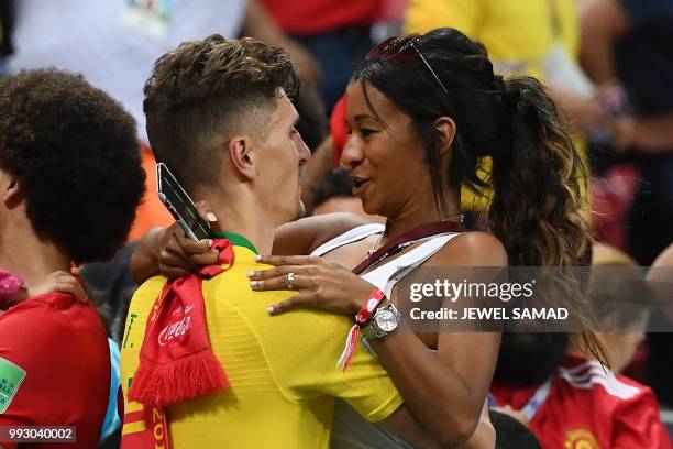 Belgium's defender Thomas Meunier celebrate with his girlfriend, Deborah Panzokou, after the Russia 2018 World Cup quarter-final football match...