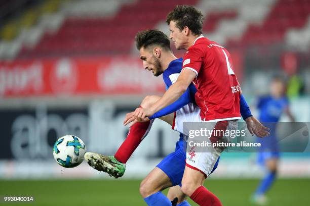 Kaiserslautern's Patrick Ziegler and Bochum's Dimitrios Diamantakos vie for the ball during the German 2nd division Bundesliga soccer match between...