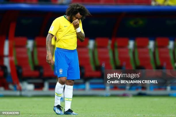 Brazil's defender Marcelo reacts to his team's defeat at the end of the Russia 2018 World Cup quarter-final football match between Brazil and Belgium...