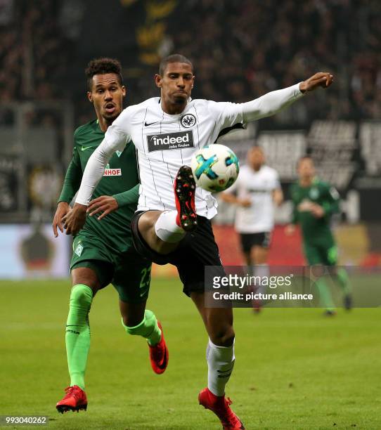 Frankfurt's Sebastien Haller in action against Bremen's Theodor Gebre Selassie during the German Bundesliga soccer match between Eintracht Frankfurt...