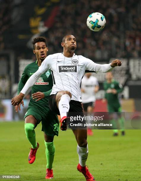 Frankfurt's Sebastien Haller in action against Bremen's Theodor Gebre Selassie during the German Bundesliga soccer match between Eintracht Frankfurt...